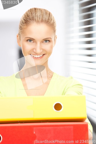 Image of businesswoman with folders