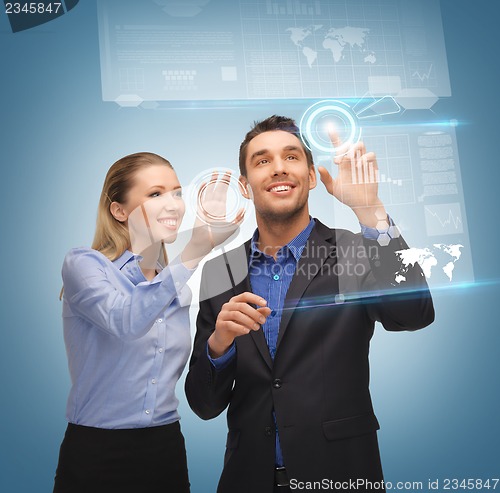 Image of man and woman working with virtual touch screens