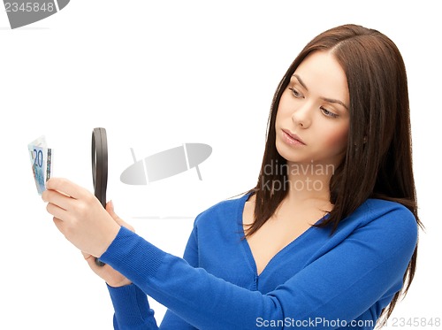 Image of woman with magnifying glass and euro cash money