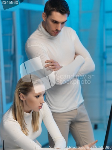 Image of man and woman in laboratory