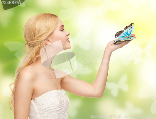 Image of woman with butterfly in hand