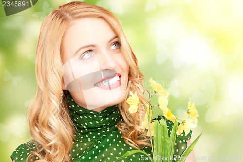 Image of lovely woman with yellow flowers and butterflies