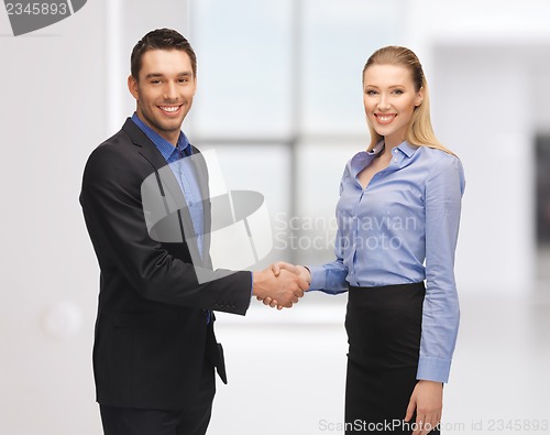 Image of man and woman shaking their hands