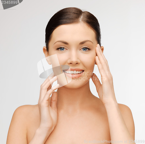 Image of face and hands of beautiful woman