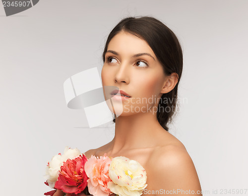 Image of relaxed woman with flowers