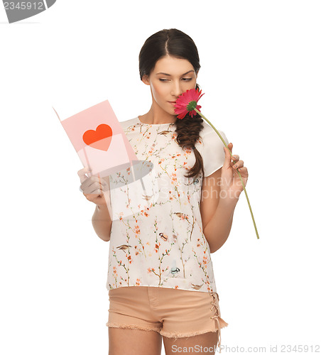 Image of young woman holding flower and  postcard