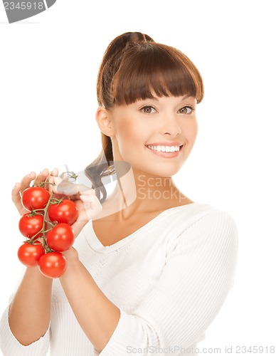 Image of beautiful woman with shiny tomatoes