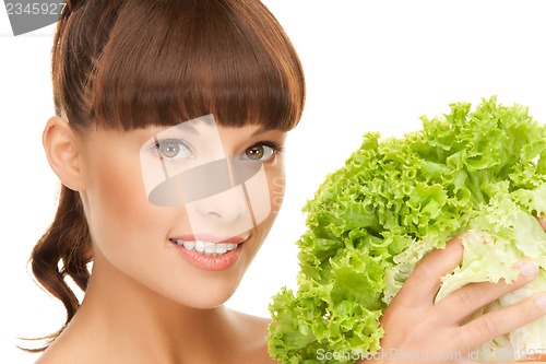 Image of woman holding lettuce