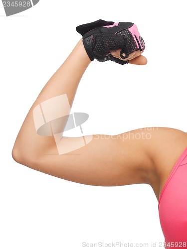 Image of sporty woman flexing her biceps