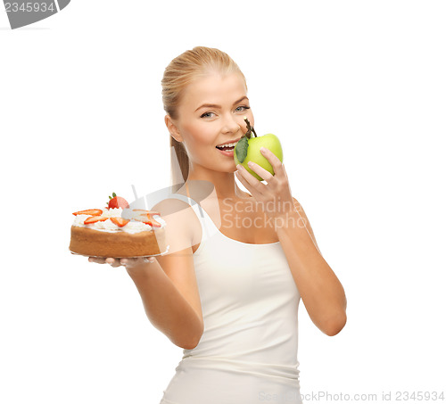 Image of woman eating apple and holding cake