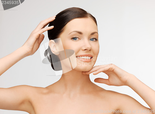 Image of face and hands of beautiful woman