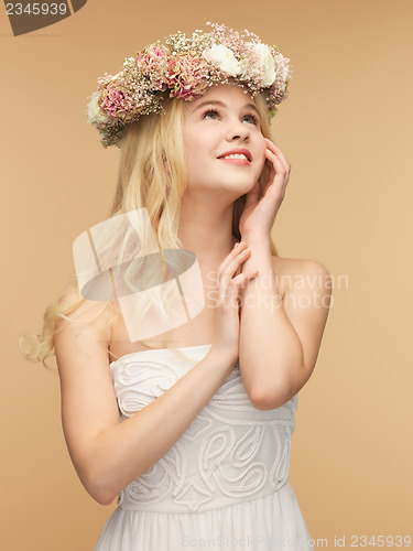 Image of woman wearing wreath of flowers