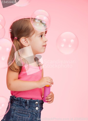 Image of litle girl with soap bubbles