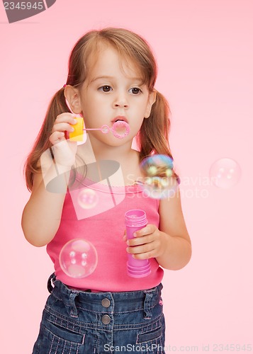 Image of litle girl with soap bubbles