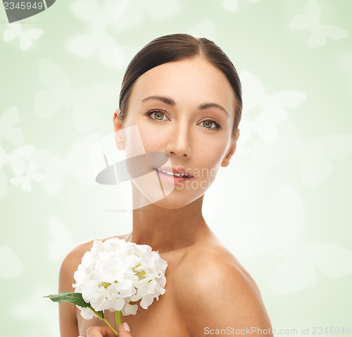 Image of beautiful woman with white flower