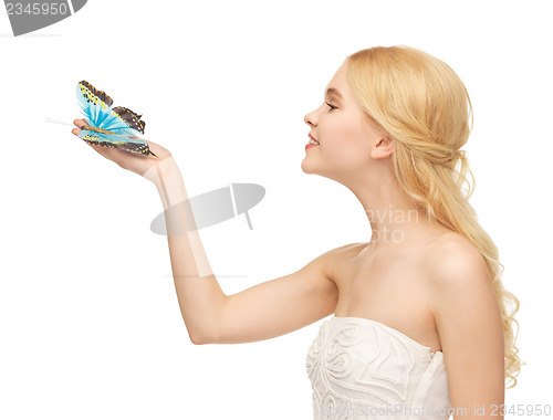 Image of woman with butterfly in hand
