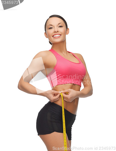 Image of sporty woman with measuring tape