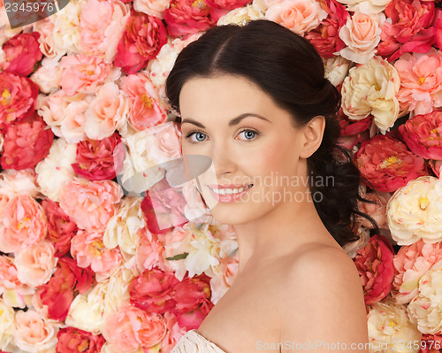 Image of woman with background full of roses