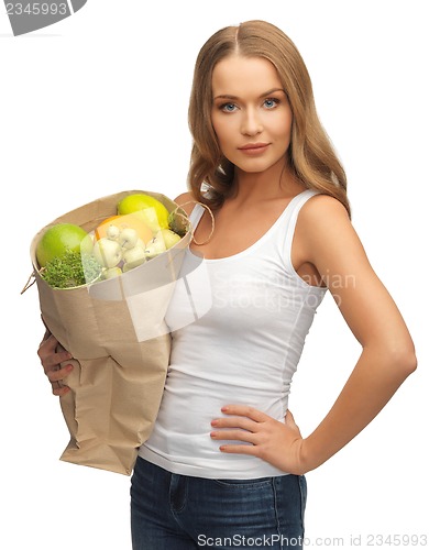 Image of woman with shopping bag full of fruits