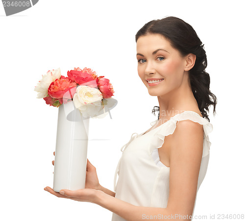 Image of woman with vase of flowers