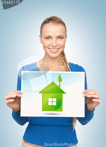 Image of woman with illustration of green eco house