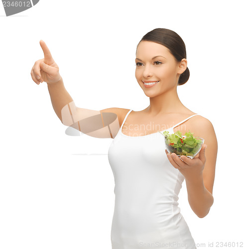 Image of healthy woman holding bowl with salad