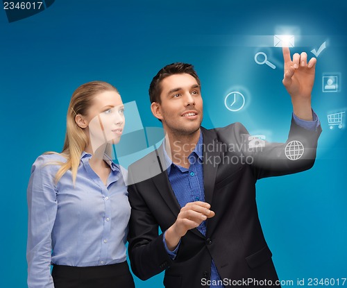 Image of man and woman working with virtual screen