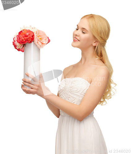 Image of woman with vase of flowers