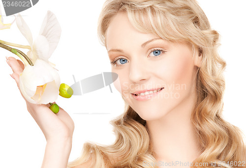 Image of lovely woman with orchid flower