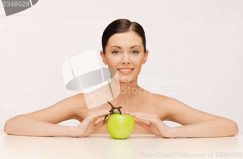 Image of woman with green apple