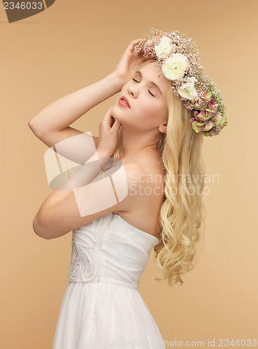 Image of woman wearing wreath of flowers