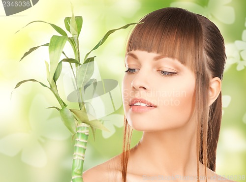 Image of woman with sprout and butterflies