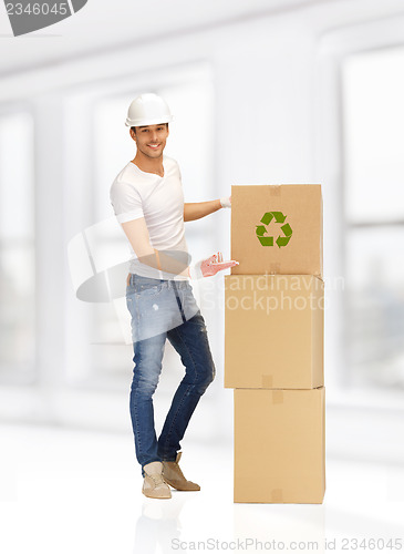 Image of handsome man with big boxes