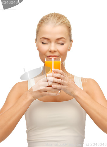 Image of young woman drinking orange juice