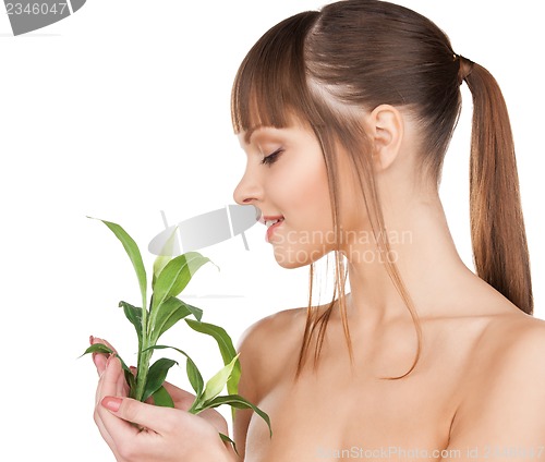 Image of woman with green sprout