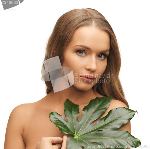 Image of woman with green leaf