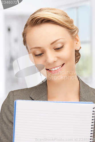 Image of happy woman with big notepad