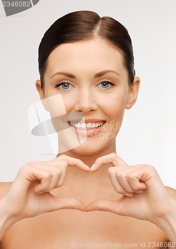 Image of woman showing heart shape