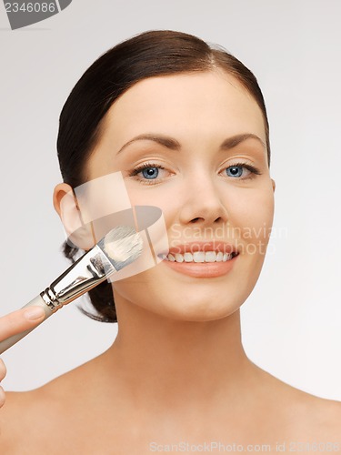 Image of beautiful woman with brush