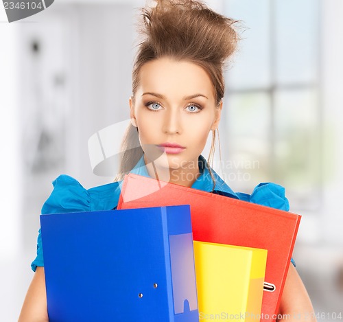 Image of serious woman with folders