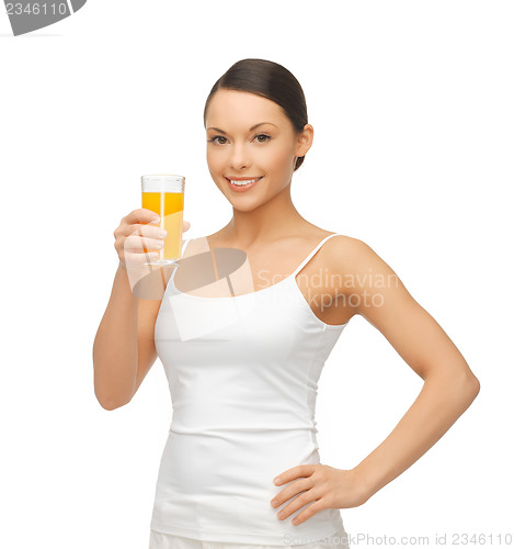 Image of woman holding glass of orange juice