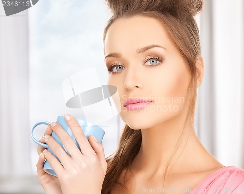 Image of woman with mug