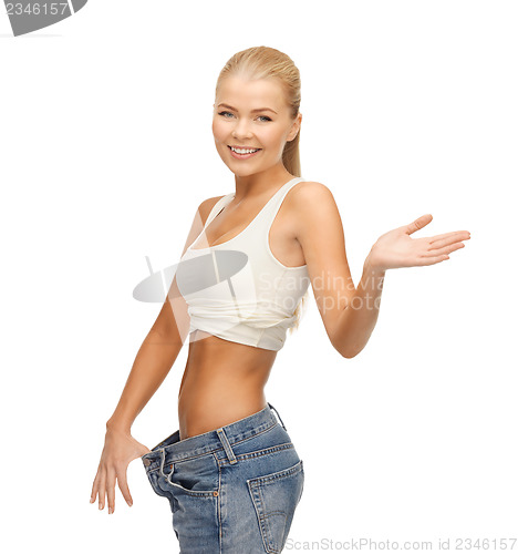 Image of sporty woman showing big pants