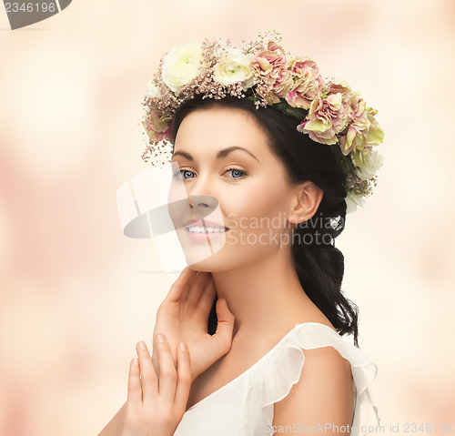 Image of woman wearing wreath of flowers