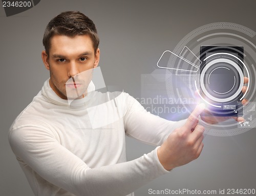 Image of man with virtual tablet pc