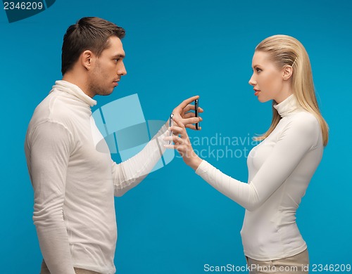 Image of man and woman with modern gadgets