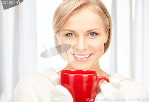 Image of woman with red mug