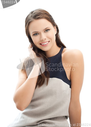 Image of happy and smiling young elegant womanl outdoors