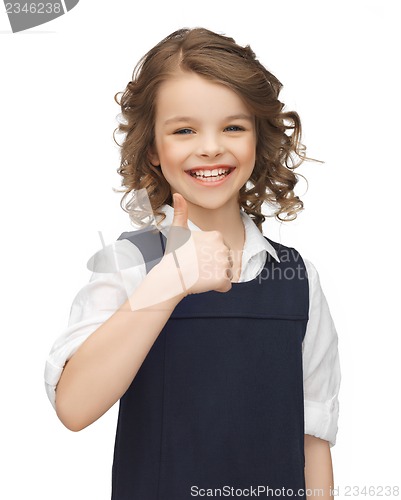 Image of pre-teen girl showing thumbs up