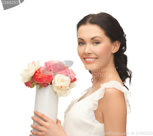 Image of woman with vase of flowers